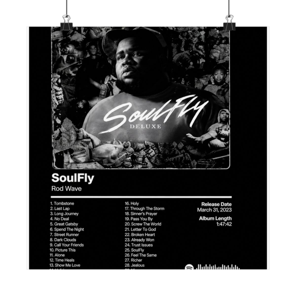 A framed black and white poster of the "SoulFly Deluxe" album by Rod Wave. The poster displays the album title, artist, tracklist, release date, and album length. The image is set against a dark... - alternate angle 1, merchandise