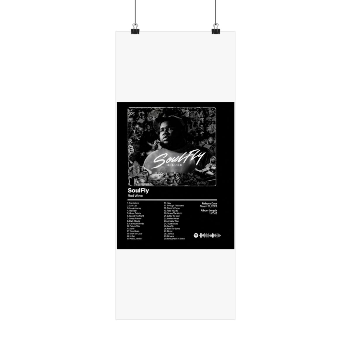 A framed black and white poster of the "SoulFly Deluxe" album by Rod Wave. The poster displays the album title, artist, tracklist, release date, and album length. The image is set against a dark... - alternate angle 2, merchandise